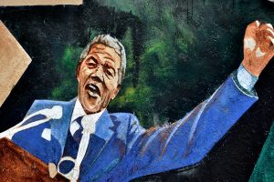 Street art in San Francisco shows Nelson Mandela addressing the massive crowd who greeted him on the Grand Parade as he gave his first speech, from a Cape Town city hall balcony, after his release on 11 February 1990 from 27 years in prison. (Julie Pimentel, CC BY-NC 2.0)