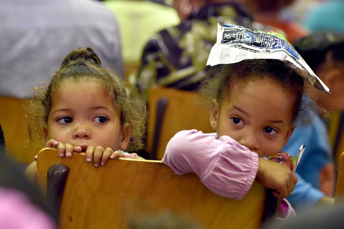 Kids at a community meeting in Elsies River, Cape Town. South Africa's Bill of Rights includes a section dedicated to the specific rights of children. (Image: GCIS)