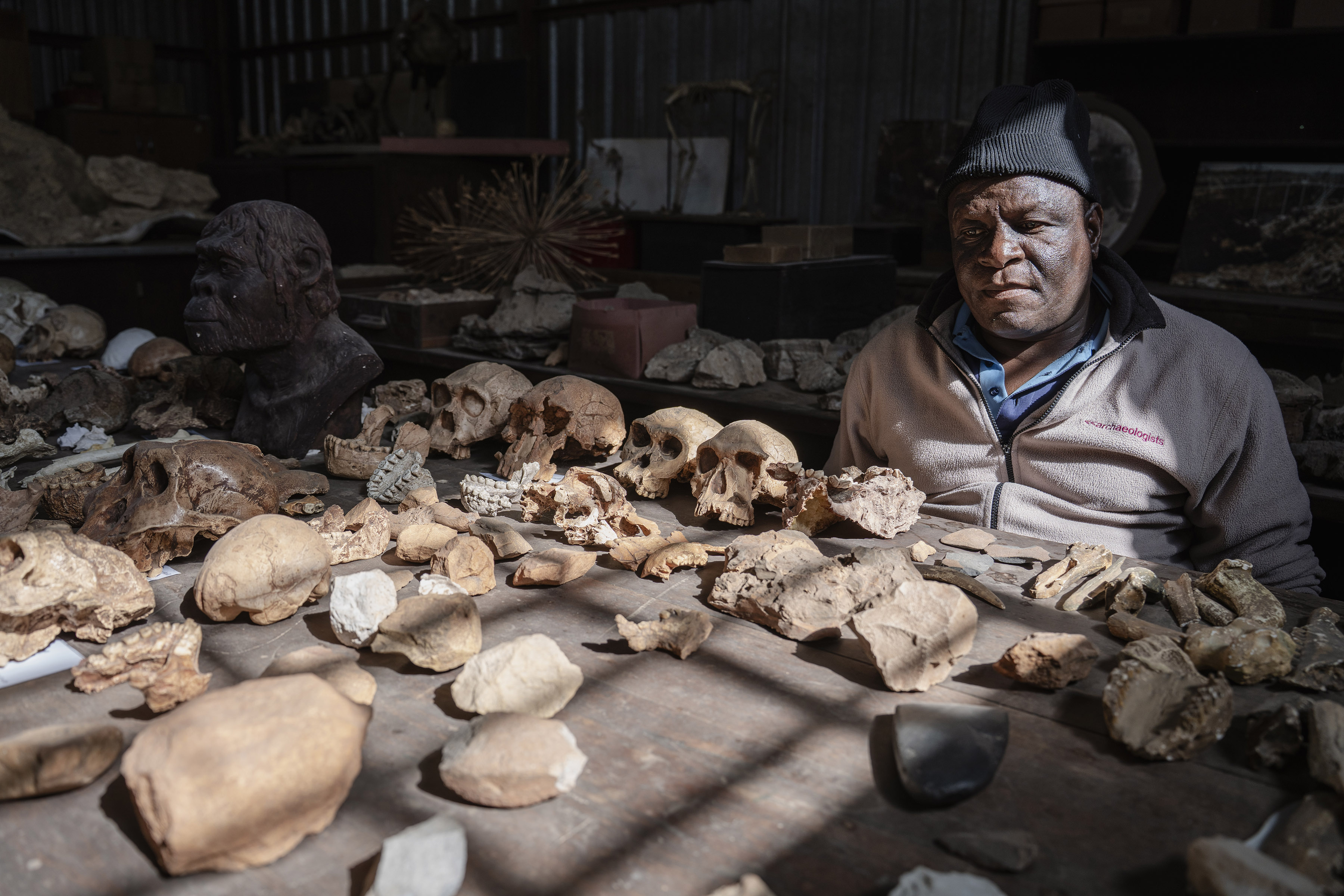 Technician Andrew Phaswana with fossil casts. Phaswana and his team create moulds from the original fossils and then cast replicas. These are used for scientific study while the precious originals are stored for safe keeping. (Photo: Ihsaan Haffejee)
